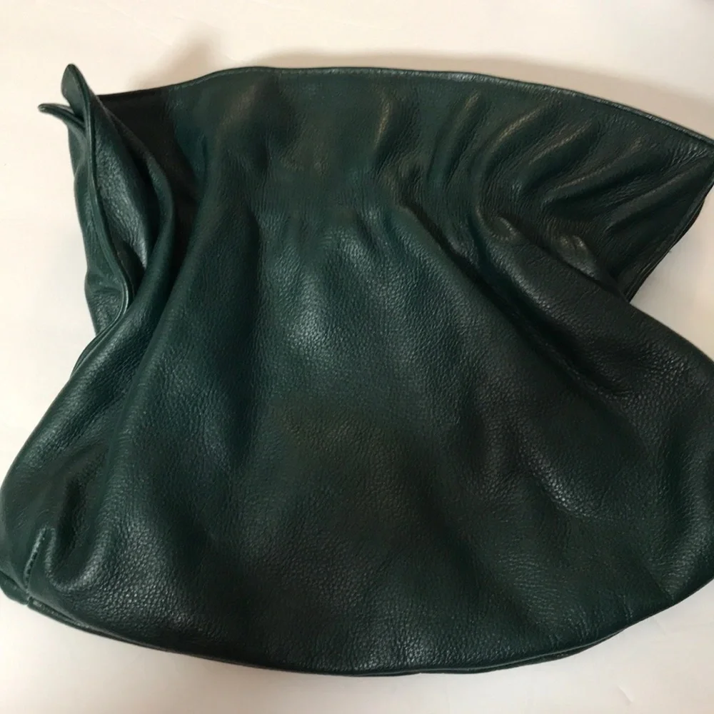 Green color leather clutch with inner pocket